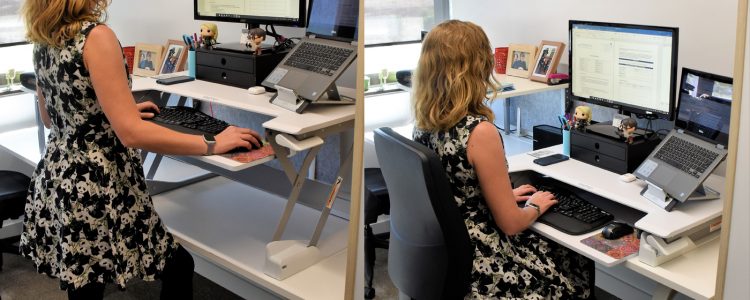 Cass Hill demonstrating Sit stand desk and ergonomic work station