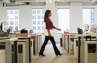 Image of office worker walking through the office